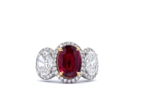 Platinum Three-Stone Ruby (2.18 CT) and Diamond (2 1/7 CT) Pave Set Halo Style Ring